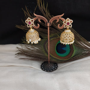 Alluring Gold Plated Jhumka With Zircon Stones With Pearl Dangling
