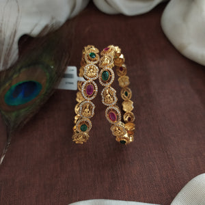 "Oval-Shaped Antique Lakshmi Bangles with Kemp, Green, and White Zircon Stones"
